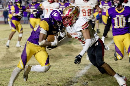 Tigers to take on Central Valley Christian Friday in Div. II championship game after big win over Centennial Tiger running back Dameion Hernandez takes on a defender at the five-yard line in Friday night's win over Centennial HIgh.